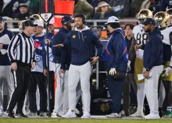 Notre Dame head coach Marcus Freeman gestures from the sideline during a game against Stanford.
