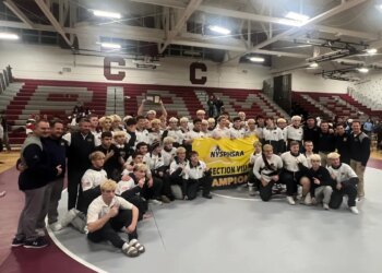 Massapequa wrestling team celebrates their Nassau County championship.