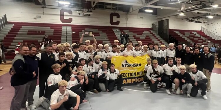 Massapequa wrestling team celebrates their Nassau County championship.