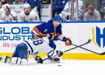 New York Islanders right wing Maxim Tsyplakov (7) skates around Toronto Maple Leafs defenseman Troy Stecher (28) during the first period at UBS Arena, Saturday, Jan. 3, 2026, in Elmont, NY.