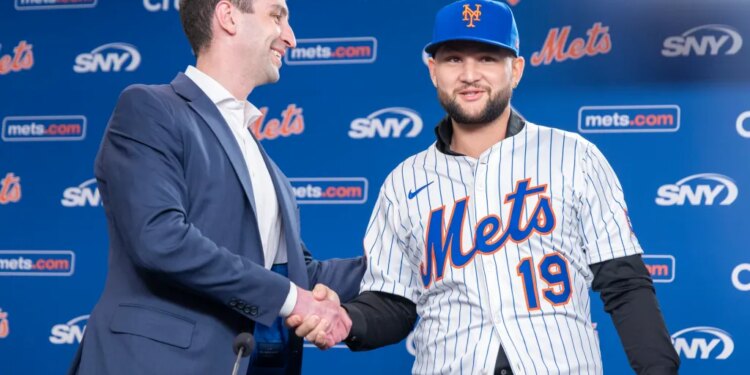 David Stearns congratulates infielder Bo Bichette at his introductory press conference at Citi Field, Wednesday, Jan. 21, 2026, in Queens, NY.