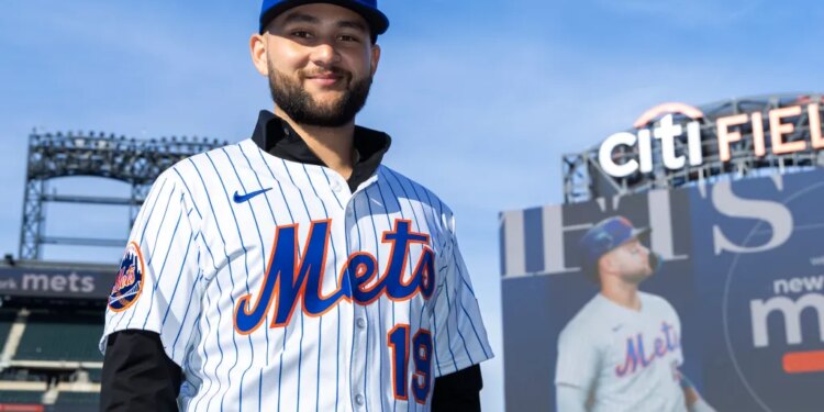 New York Mets infielder Bo Bichette poses on the field in his team uniform after his introductory press conference at Citi Field.