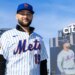 New York Mets infielder Bo Bichette poses on the field in his team uniform after his introductory press conference at Citi Field.