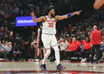 Karl-Anthony Towns reacts after a basket against the Portland Trail Blazers during the first half of an NBA basketball game Sunday, Jan. 11, 2026, in Portland, Ore.