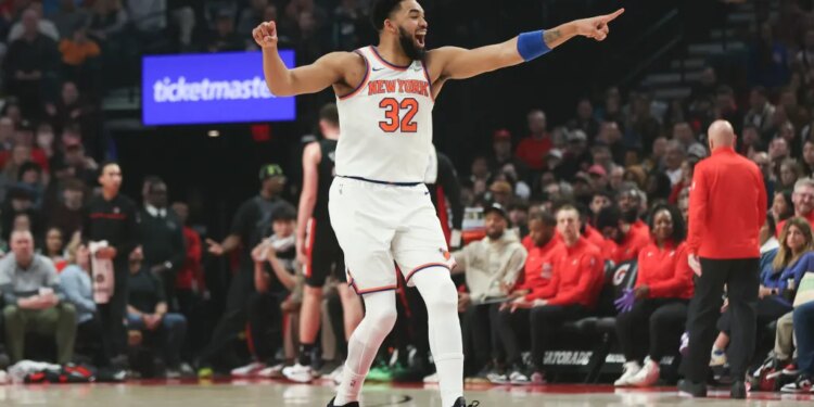 Karl-Anthony Towns reacts after a basket against the Portland Trail Blazers during the first half of an NBA basketball game Sunday, Jan. 11, 2026, in Portland, Ore.
