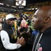 Mike Tomlin (l.) greets Texans coach DeMeco Ryans (r.) following Houston's wild-card win over Pittsburgh on Jan. 12, 2026.
