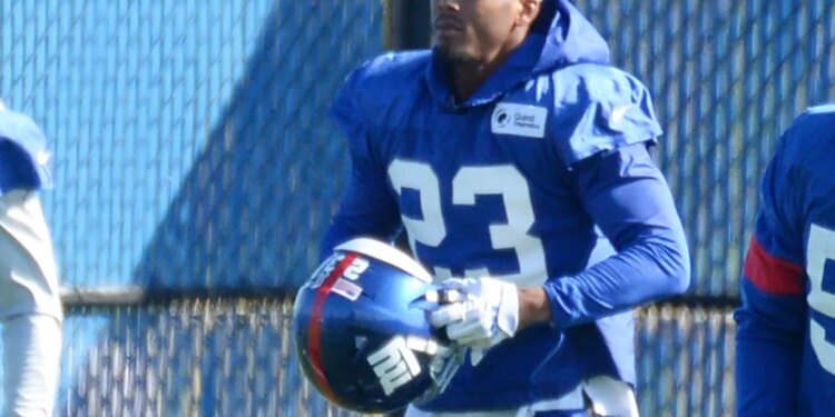 New York Giants defensive back Sam Beal #23 holds his helmet during practice.