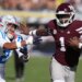 Mississippi State quarterback Kamario Taylor (1) stiff arms Mississippi cornerback Jaylon Braxton (2) as he runs for 22-yard touchdown during the first half of an NCAA college football game Nov. 28, 2025, in Starkville, Miss. (AP Photo/Rogelio V. Solis, File)