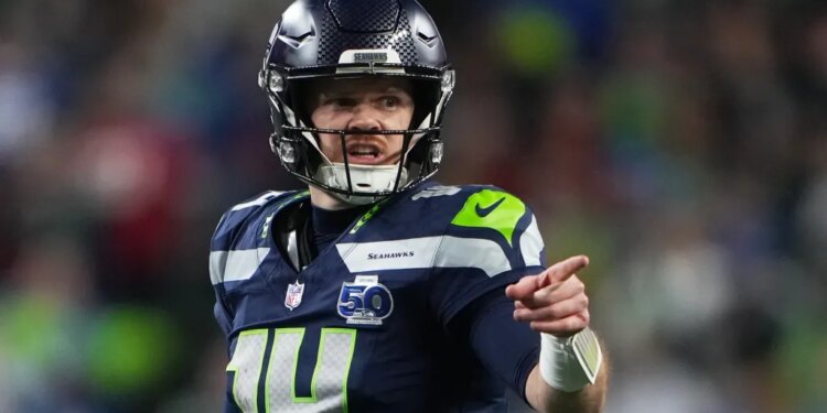 Seattle Seahawks quarterback Sam Darnold reacts during the second half of an NFL football divisional playoff game against the San Francisco 49ers, Saturday, Jan. 17, 2026, in Seattle.
