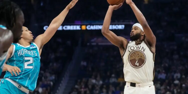 Golden State Warriors guard Moses Moody (4) shoots a 3-point basket against Charlotte Hornets forward Grant Williams (2) during the first half of an NBA basketball game in San Francisco, Saturday, Jan. 17, 2026.