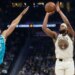 Golden State Warriors guard Moses Moody (4) shoots a 3-point basket against Charlotte Hornets forward Grant Williams (2) during the first half of an NBA basketball game in San Francisco, Saturday, Jan. 17, 2026.