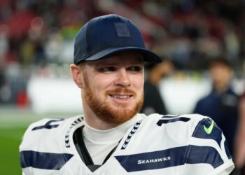 Seattle Seahawks quarterback Sam Darnold smiles.