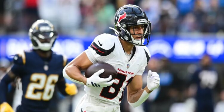 Houston Texans wide receiver Jayden Higgins (81) runs toward the end zone with the ball during a football game.