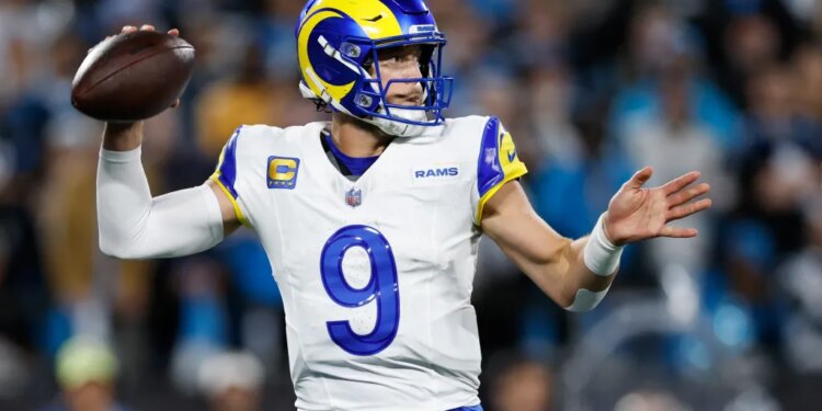Los Angeles Rams quarterback Matthew Stafford (9) throws a pass during the second half of an NFL wild-card playoff football game against the Carolina Panthers, Saturday, Jan. 10, 2026, in Charlotte, N.C.