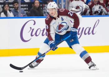 Jan 25, 2026; Toronto, Ontario, CAN; Colorado Avalanche forward Nathan MacKinnon (29) carries the puck against the Toronto Maple Leafs during the second period at Scotiabank Arena. Mandatory Credit: John E. Sokolowski-Imagn Images