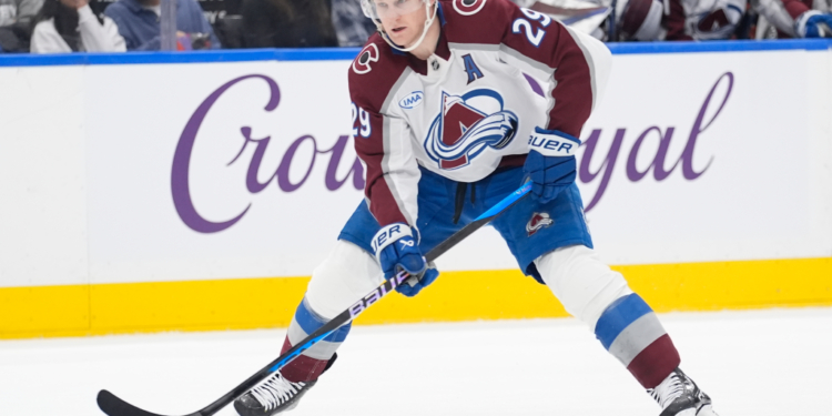 Jan 25, 2026; Toronto, Ontario, CAN; Colorado Avalanche forward Nathan MacKinnon (29) carries the puck against the Toronto Maple Leafs during the second period at Scotiabank Arena. Mandatory Credit: John E. Sokolowski-Imagn Images