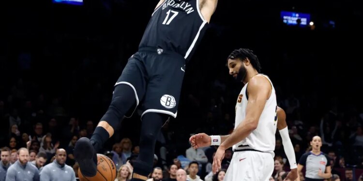 Michael Porter Jr. #17 of the Brooklyn Nets slams the ball in the second half. The Brooklyn Nets defeat the Denver Nuggets at the Barclays Center in Brooklyn, New York, Sunday, January 04, 2026.