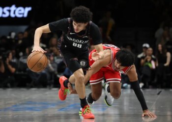Nolan Traore looks to grab a loose ball past stumbling Tre Jones during the Nets' 112-109 win over the Bulls on Jan. 16, 2025 at Barclays Center.