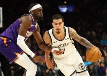 Michael Porter Jr. who scored a game-high 36 points, drives on Mark Williams during the Nets' 106-102 loss to the Suns on Jan. 27, 2026 in Phoenix.