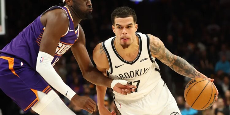 Michael Porter Jr. who scored a game-high 36 points, drives on Mark Williams during the Nets' 106-102 loss to the Suns on Jan. 27, 2026 in Phoenix.