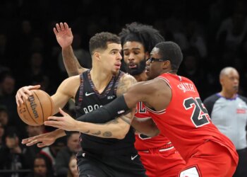 Jalen Smith #25 of the Chicago Bulls defends against Michael Porter Jr. #17 of the Brooklyn Nets as Porter Jr. looks for the open man during the second quarter.
