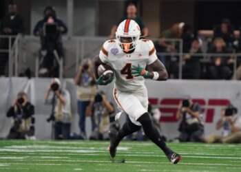 Miami Hurricanes defensive lineman Rueben Bain Jr. (4) moves the ball against the Ohio State Buckeyes.