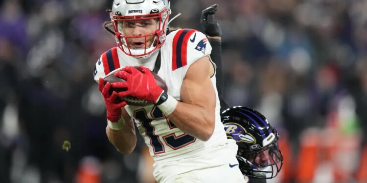 New England Patriots wide receiver Mack Hollins (13) running with the ball against the Baltimore Ravens.