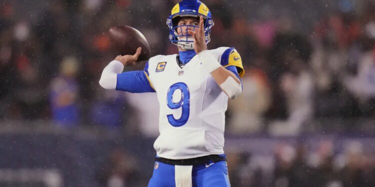 Matthew Stafford warming up for an NFL football playoff game.