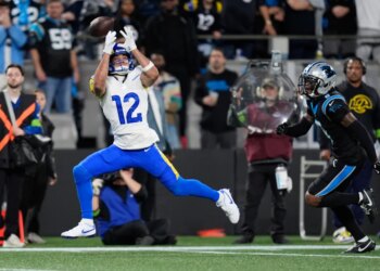 Los Angeles Rams wide receiver Puka Nacua (12) misses on a catch attempt during the first half of an NFL wild-card playoff football game against the Carolina Panthers, Saturday, Jan. 10, 2026, in Charlotte, N.C. (