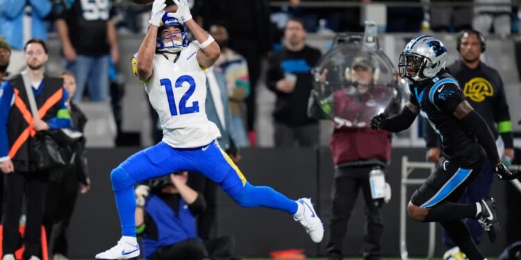 Los Angeles Rams wide receiver Puka Nacua (12) misses on a catch attempt during the first half of an NFL wild-card playoff football game against the Carolina Panthers, Saturday, Jan. 10, 2026, in Charlotte, N.C. (