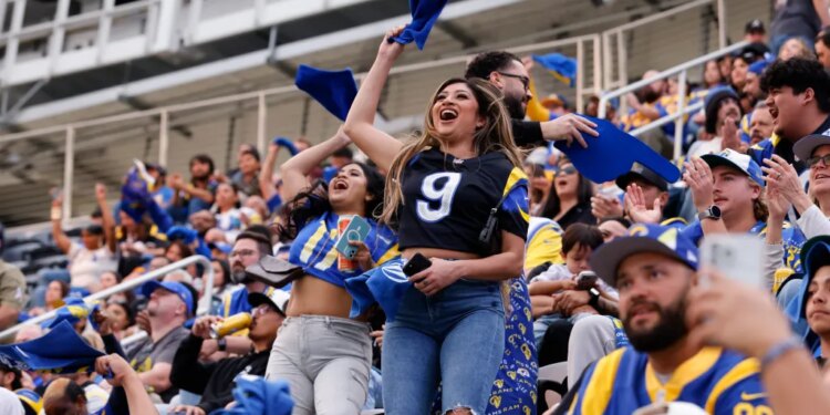 Rams fans cheering at a watch party at Sofi Stadium.