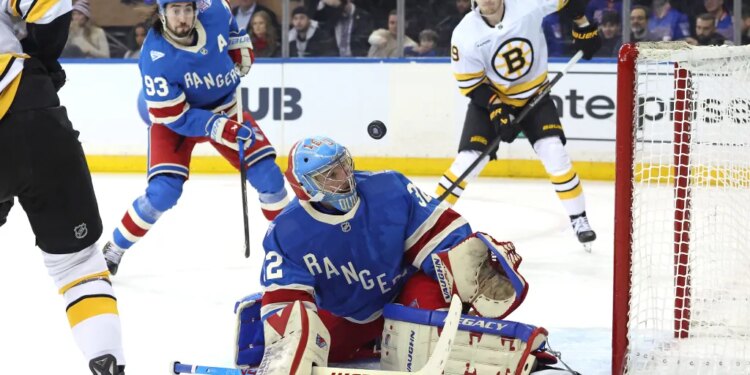 New York Rangers goaltender Jonathan Quick #32 watches as the puck hits off the goal post during the second period.
