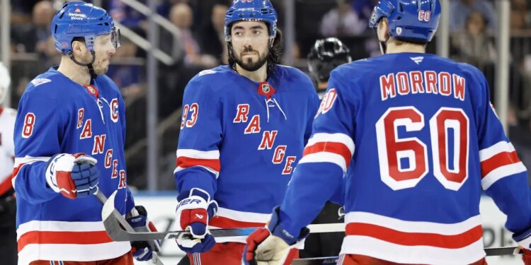 J.T. Miller and New York Rangers center Mika Zibanejad react on the ice during the second period at Madison Square Garden in New York, New York, Monday, January 14, 2026.