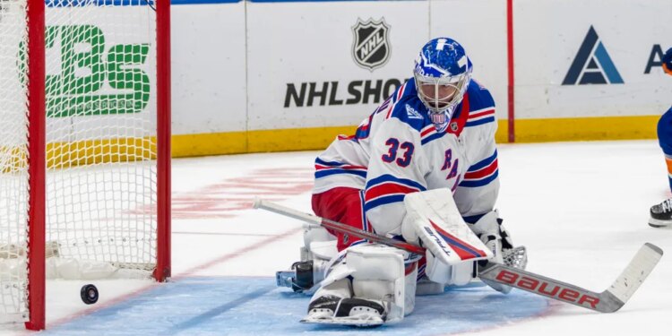 Rangers top goalie prospect Dylan Garand, giving up a goal during a preseason game, is remaining in the AHL despite Igor Shesterkin's injury.
