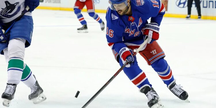 New York Rangers center Vincent Trocheck (16) tries to maintain possession during the first period when the New York Rangers played the Vancouver Canucks Tuesday, December 16, 2025 at Madison Square Garden in Manhattan, NY.