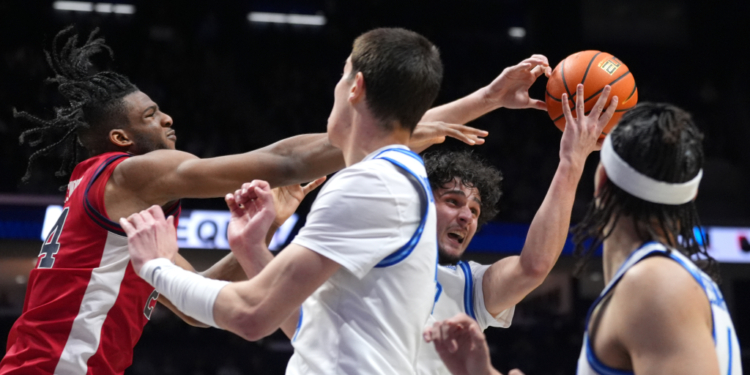 Zuby Ejiofor, battling for a rebound in St. John's win over Xavier, fouled out in the victory, but Rick Pitino thought the officials got four of those calls wrong.