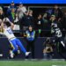 Rams wide receiver Puka Nacua (12) makes a touchdown catch past Seahawks cornerback Riq Woolen (27) during the second half of the NFC Championship game on Jan. 25, 2026.