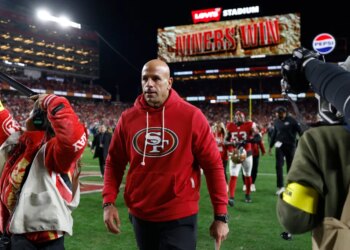 San Francisco 49ers defensive coordinator Robert Saleh leaves the field after defeating the Chicago Bears.