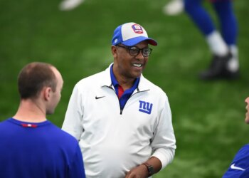 Ronnie Barnes wearing a New York Giants cap and jacket.