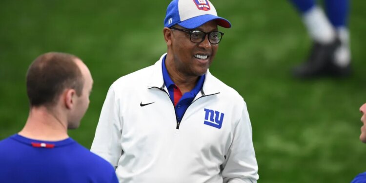 Ronnie Barnes wearing a New York Giants cap and jacket.