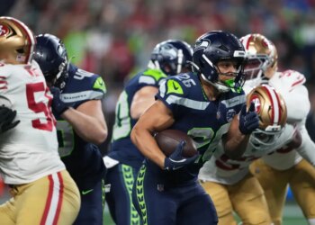 Seattle Seahawks running back Zach Charbonnet (26) holds on to the ball during the team's win over the 49ers on Jan. 17, 2026.