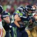 Seattle Seahawks running back Zach Charbonnet (26) holds on to the ball during the team's win over the 49ers on Jan. 17, 2026.