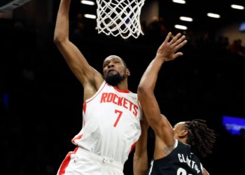 Kevin Durant #7 of the Houston Rockets slams the ball over Nic Claxton #33 of the Brooklyn Nets in the first half at the Barclays Center in Brooklyn, New York, Thursday, January 01, 2026.