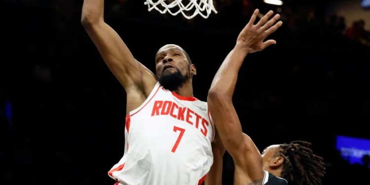 Kevin Durant #7 of the Houston Rockets slams the ball over Nic Claxton #33 of the Brooklyn Nets in the first half at the Barclays Center in Brooklyn, New York, Thursday, January 01, 2026.