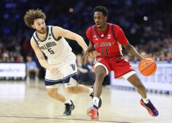St. John's Red Storm guard Ian Jackson (11) drives against Villanova Wildcats guard Devin Askew (5) during the second half at Xfinity Mobile Arena.