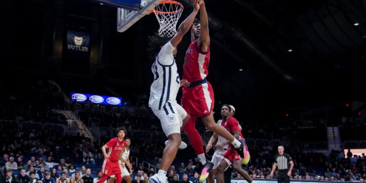 Zuby Ejiofor deflects the ball away from Azavier Robinson during the second half of St. John's 84-70 road win over Butler at Hinkle Fieldhouse.