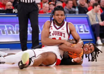 Zuby Ejiofor of the St. John's Red Storm and Jamier Jones of the Providence Friars fight for control of the ball.