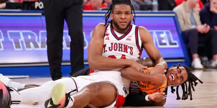 Zuby Ejiofor of the St. John's Red Storm and Jamier Jones of the Providence Friars fight for control of the ball.
