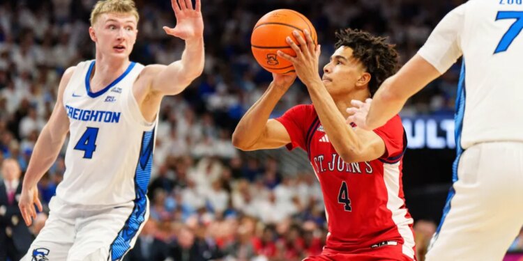 St. John's Red Storm guard Oziyah Sellers (4) shooting the ball against Creighton Bluejays guard Josh Dix (4) and guard Fedor Žugić (7).