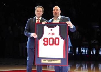 St. John's Red Storm head coach Rick Pitino presented with a jersey commemorating his 900th win.